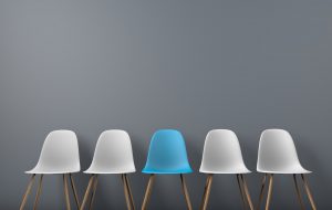 Row of chairs with one odd one out. Job opportunity. Business leadership. recruitment concept. 3D rendering